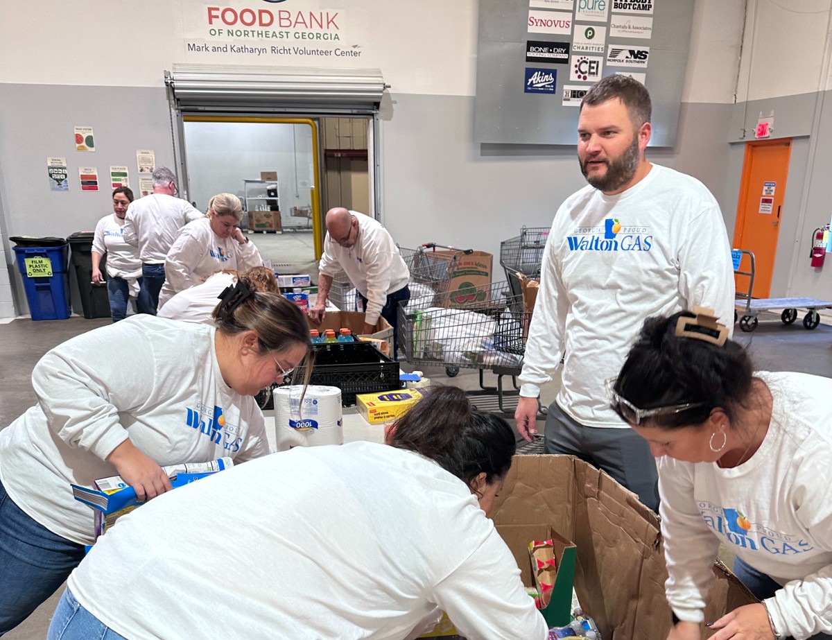 Walton Gas employees sort through donations at the Food Bank of Northeast Georgia
