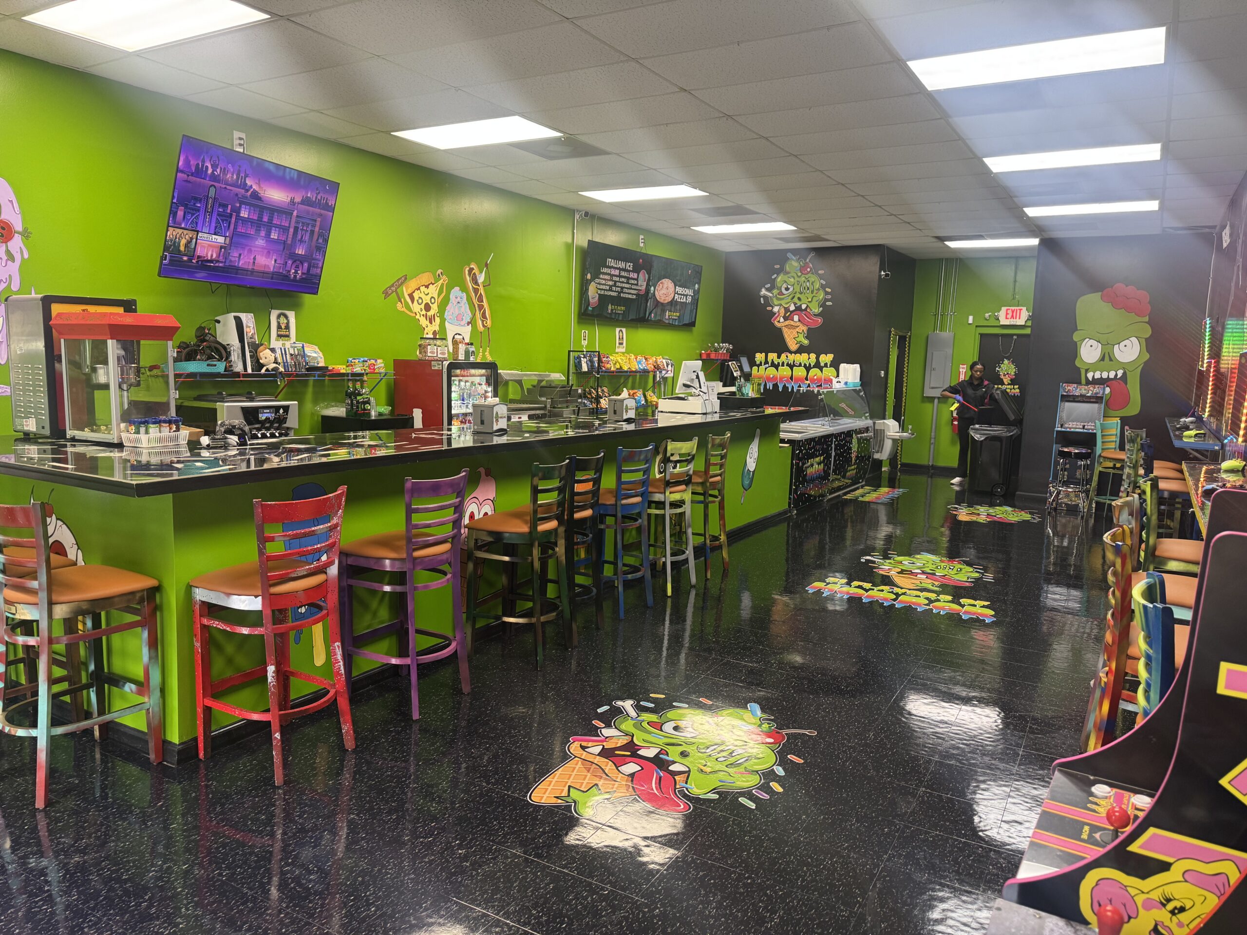 A bright interior with a playful monster theme welcomes customers who come for sweet treats and the free video and arcade games offered with purchase at 31 Flavors of Horror.
