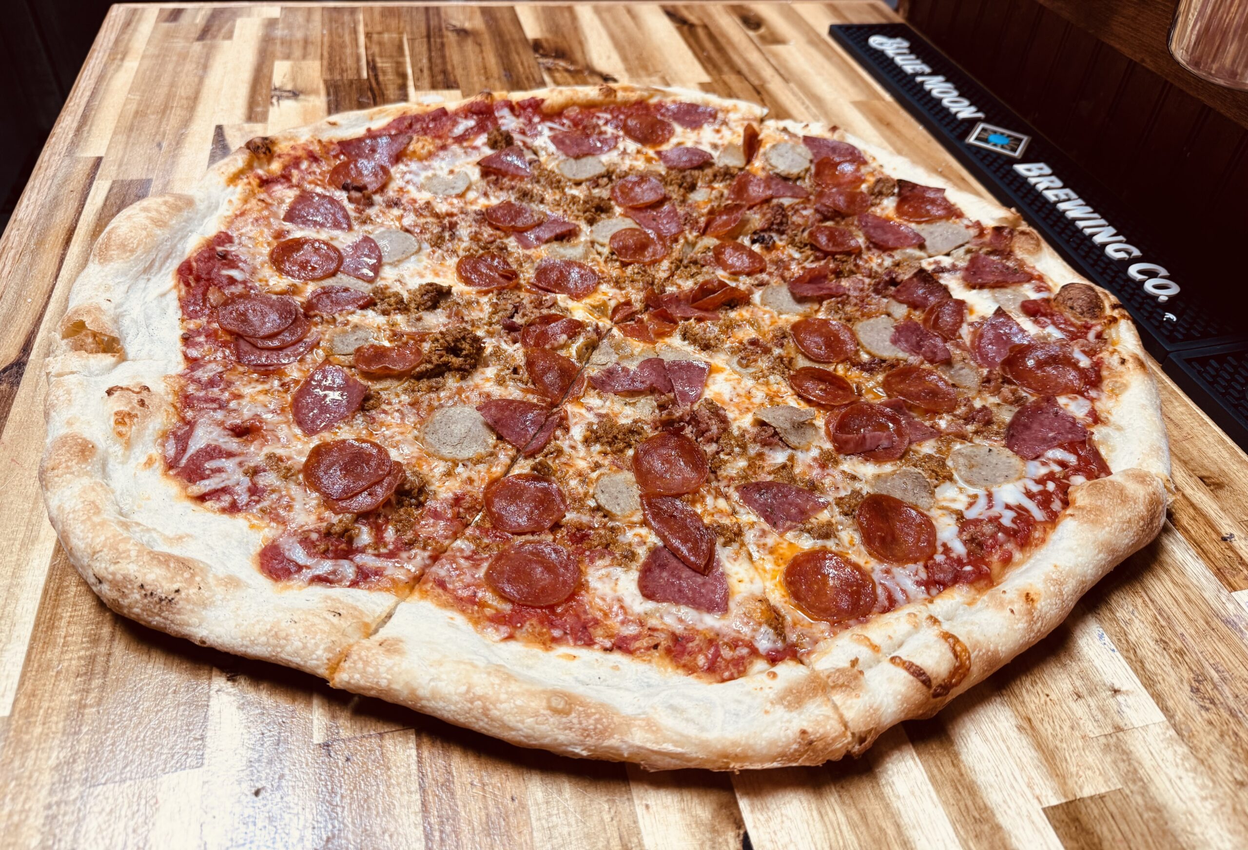 AJ’s Pizza Pub in Cornelia is the home of The Goliath, a 24-inch pizza. Owner Andri Demus says he developed the plus-sized pie as “a challenge for people to eat,” but it has instead become a popular menu item for families and group meals.